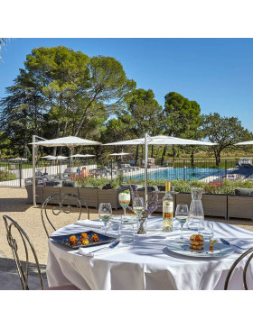 Bistro dining set table and chairs on terrace infront of pool