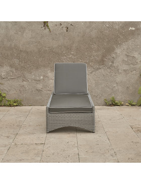 Rattan sun lounger with French grey UV resistant cushions on a southern French terrace