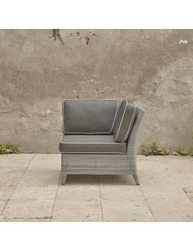 Oceane corner piece . French grey rattan on a southern French terrace. Pictured from the side with backrest on the right