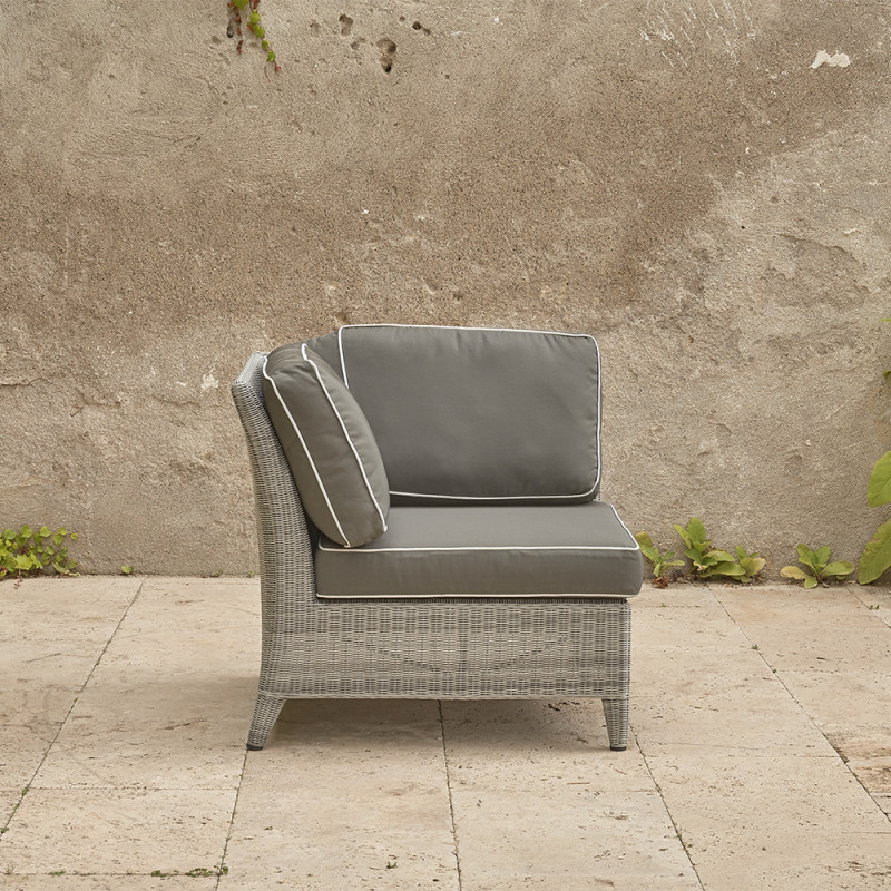 Oceane corner piece . French grey rattan on a southern French terrace. Pictured from the side with backrest on the left