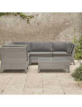 Oceane modular set showing three corners and two middle seats and a coffee table French grey rattan on Southern French terrace.