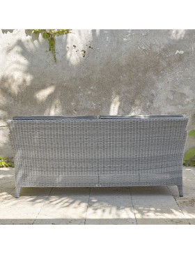 Two-seater rattan couch with UV resistant cushions back view in French grey on a southern French terrace