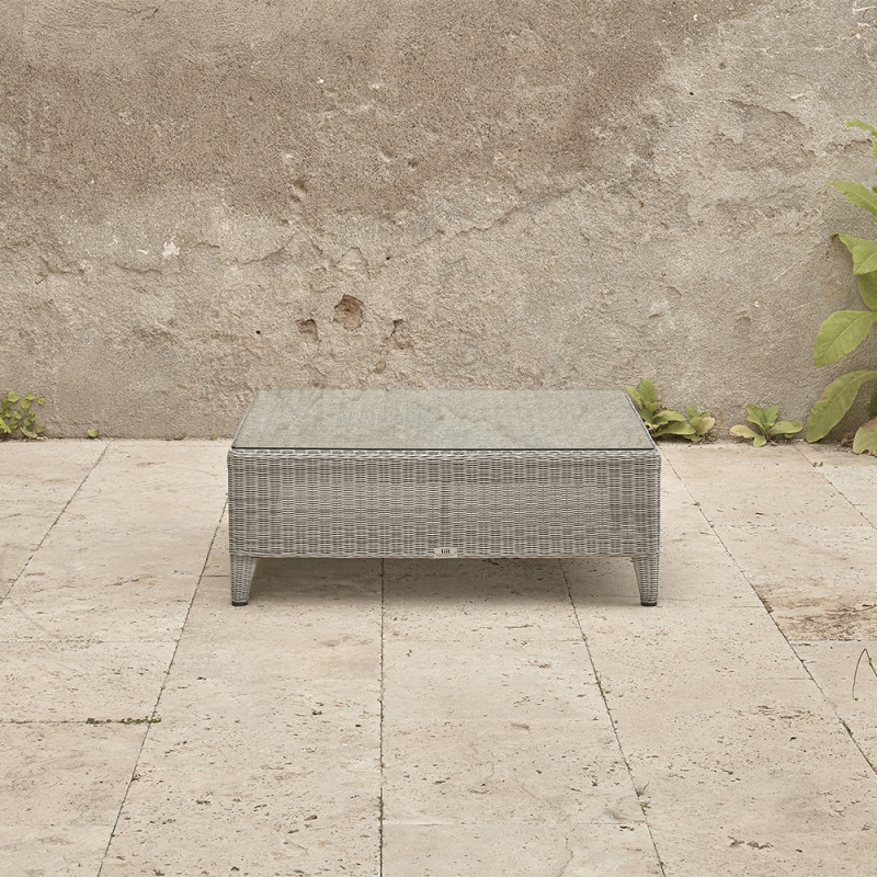 Oceane garden corner coffee table with tempered glass top French grey rattan pictured on Southern French terrace.