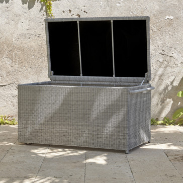 Rattan garden storage box on a southern french terrace pictured with the lid open