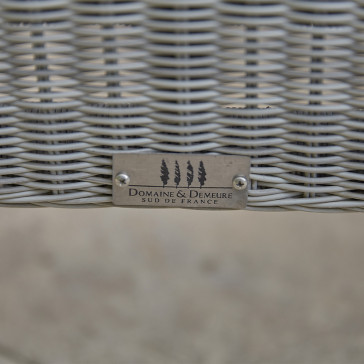 Close up of Domaine & Demeure logo on rattan garden furniture