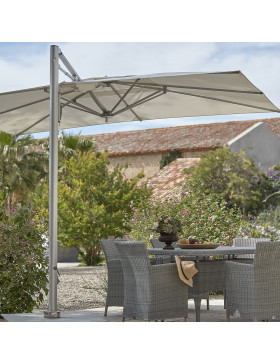 Tucci parasol in a garden giving shade to a dining table and chairs