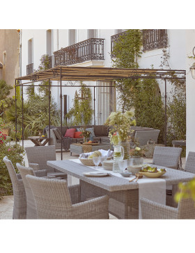 8 seater table and chairs. French Grey rattan. Corner lounge set on a French terrace.