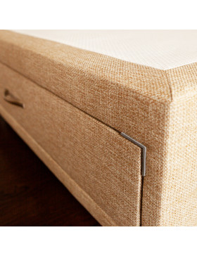 Close up image of Divan bed base with drawer upholstered in an oatmeal furniture fabric pictured on a wooden floor